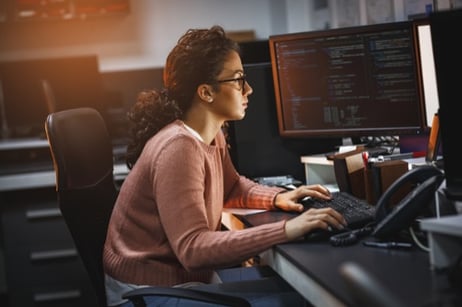 Female Business Technologist using low-code and no-code software